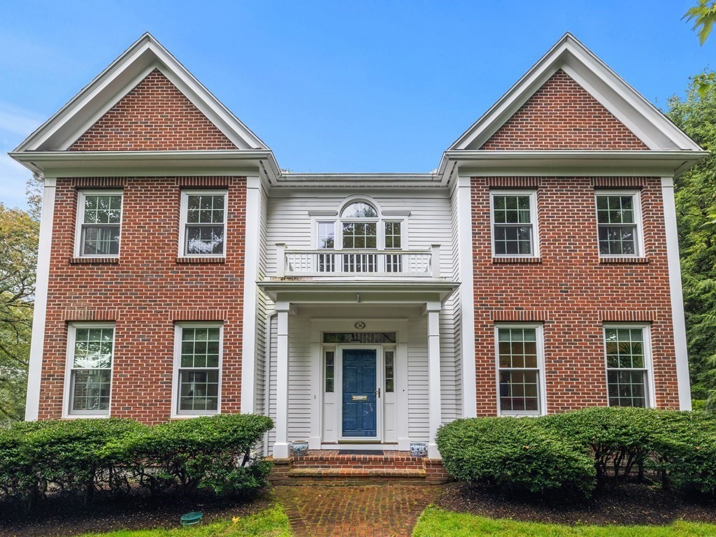 34 Upwey Road Wellesley, MA 02481 - Photo 1 of 19 front view of a brick house with a yard