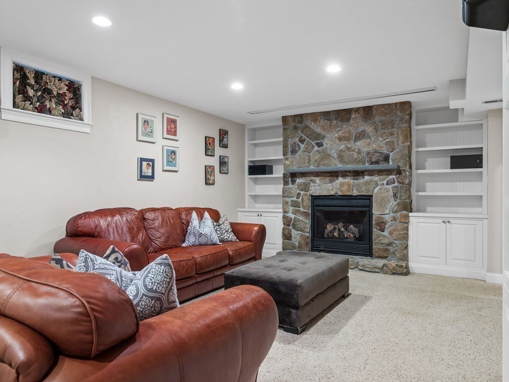 34 Upwey Road Wellesley, MA 02481 - Photo 17 of 19 a living room with furniture and a fireplace