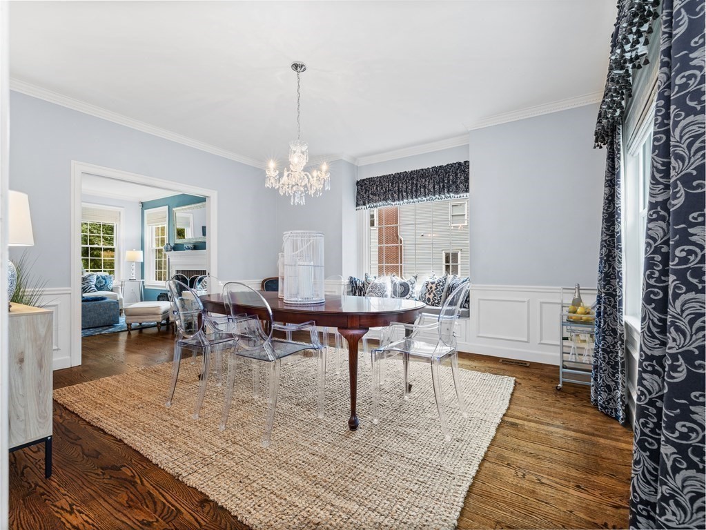 34 Upwey Road Wellesley, MA 02481 - Photo 4 of 19 a living room with furniture and a chandelier