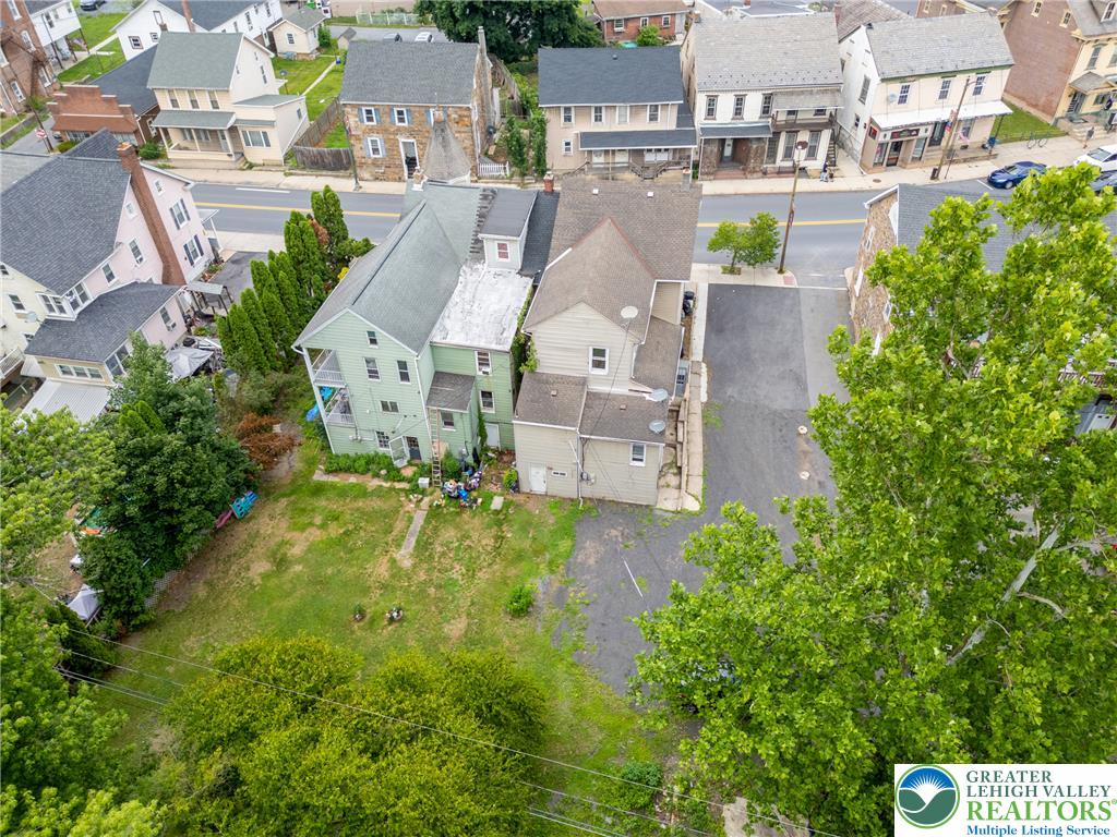 313 Main Street Slatington, PA 18080 - Photo 68 of 73 An aerial perspective reveals a two-story residence with a generous backyard, nestled within a charming neighborhood setting.