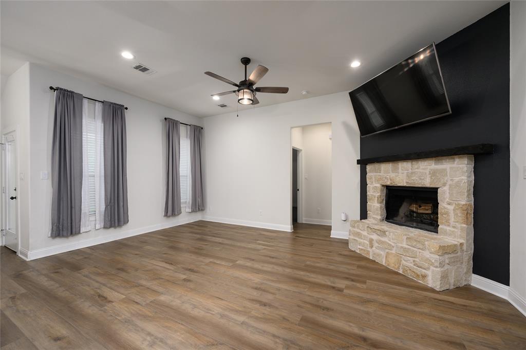 300 Bronco Drive Pilot Point, TX 76258 - Photo 12 of 31 a view of an empty room with a fireplace