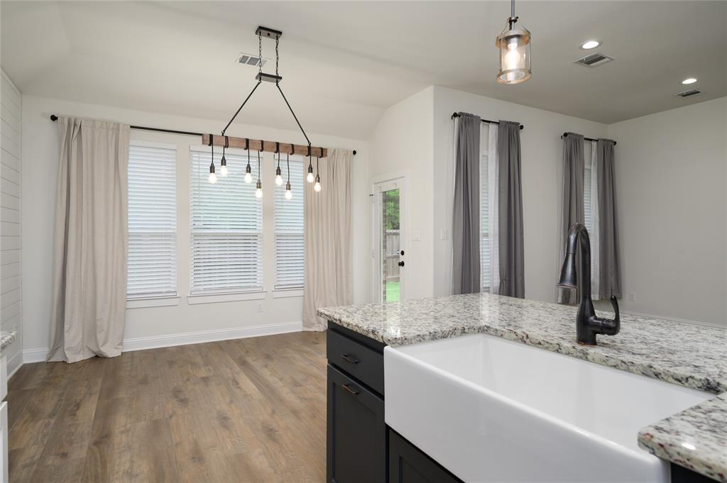 300 Bronco Drive Pilot Point, TX 76258 - Photo 14 of 31 a bathroom with a tub sink and mirror