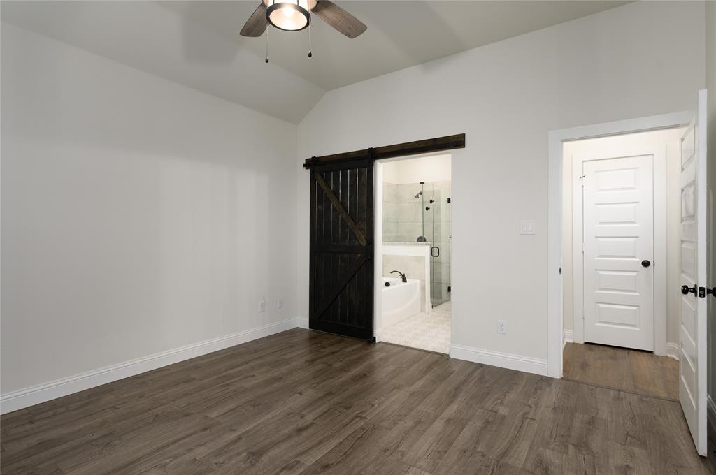 300 Bronco Drive Pilot Point, TX 76258 - Photo 19 of 31 an empty room with wooden floor and cabinet