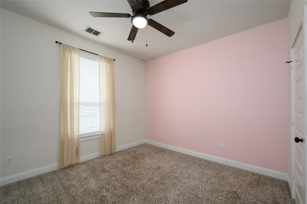 300 Bronco Drive Pilot Point, TX 76258 - Photo 25 of 31 an empty room with windows and fan