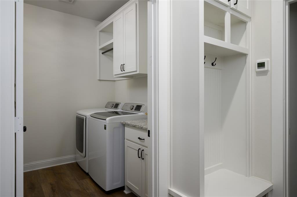 300 Bronco Drive Pilot Point, TX 76258 - Photo 27 of 31 a utility room with wooden floor cabinetry and a sink