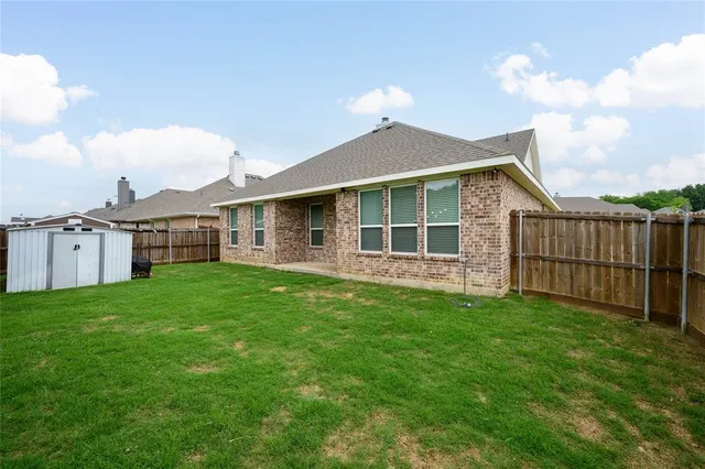 a view of a yard in front of a house with a yard