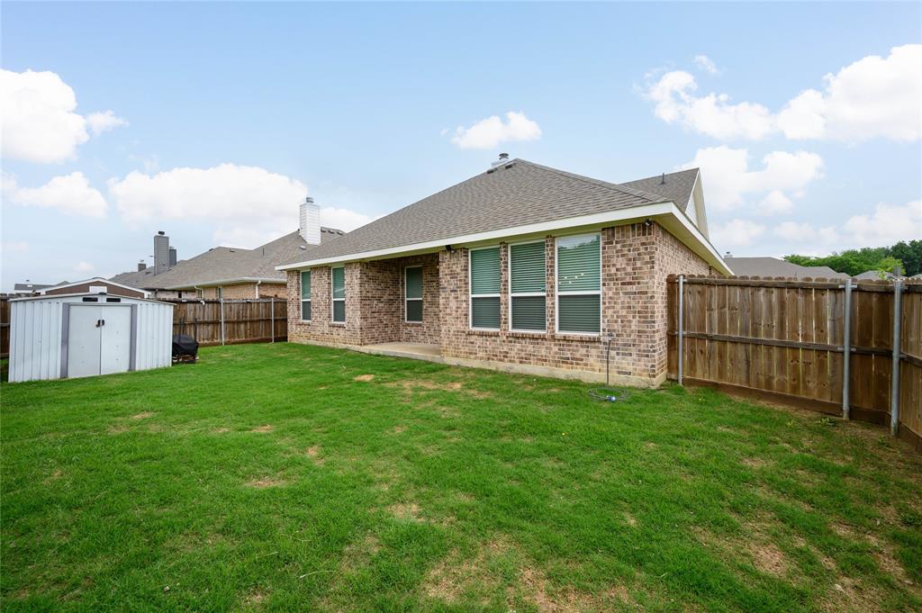 300 Bronco Drive Pilot Point, TX 76258 - Photo 30 of 31 a view of a yard in front of a house with a yard