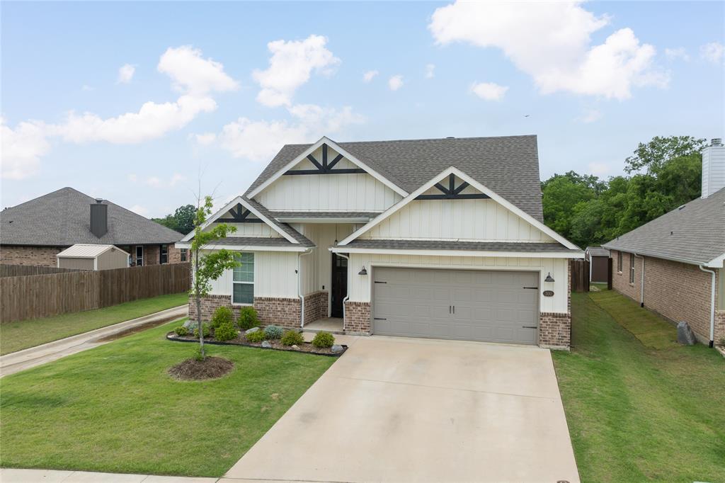 300 Bronco Drive Pilot Point, TX 76258 - Photo 3 of 31 a view of a house with a yard and potted plants