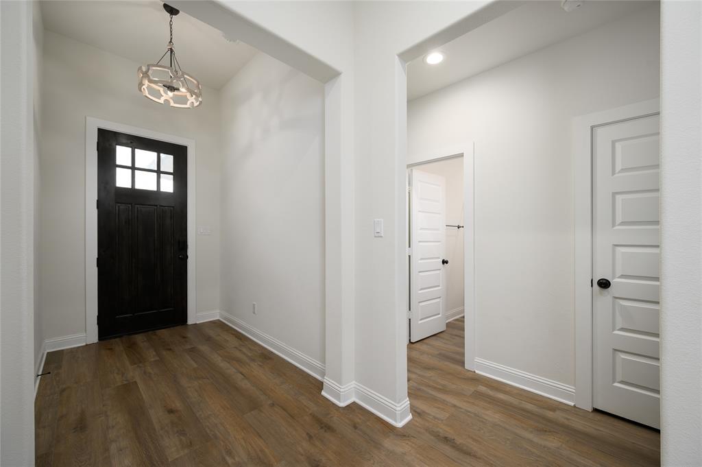 300 Bronco Drive Pilot Point, TX 76258 - Photo 7 of 31 a view of a room with wooden floor and closet