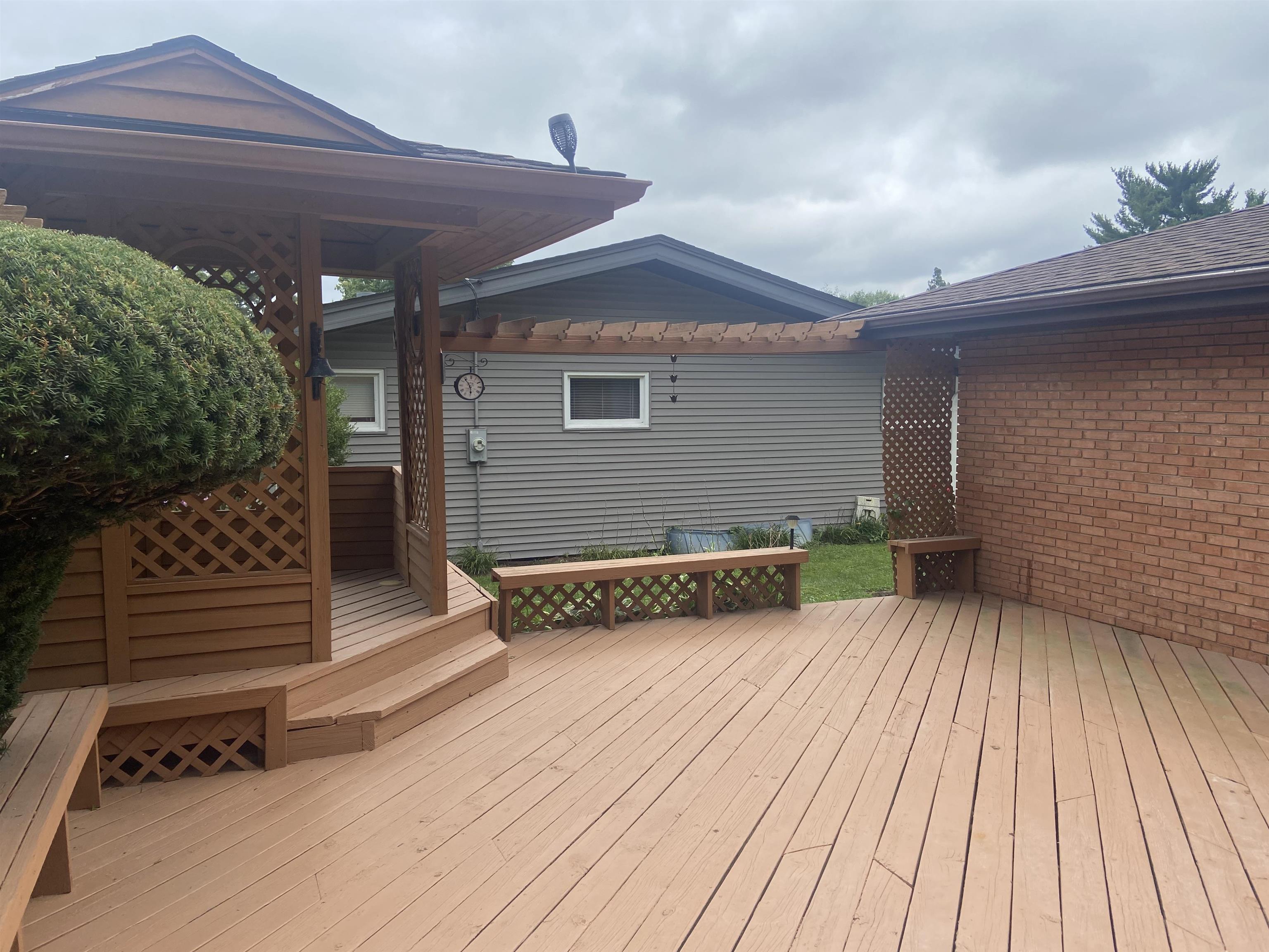 4006 Highcrest Road Rockford, IL 61107 - Photo 12 of 18 a view of backyard with a deck