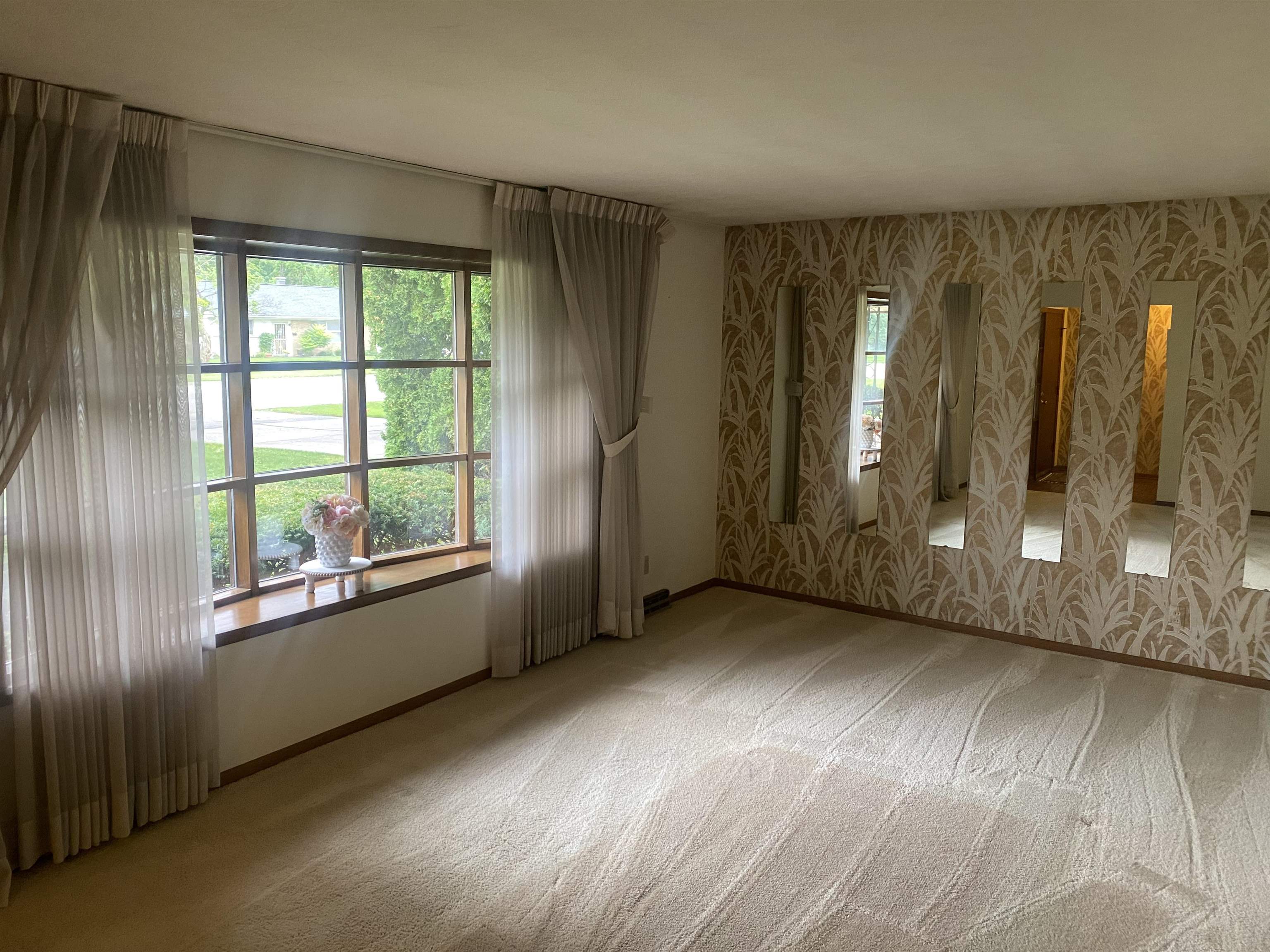 4006 Highcrest Road Rockford, IL 61107 - Photo 3 of 18 an empty room with wooden floor and windows