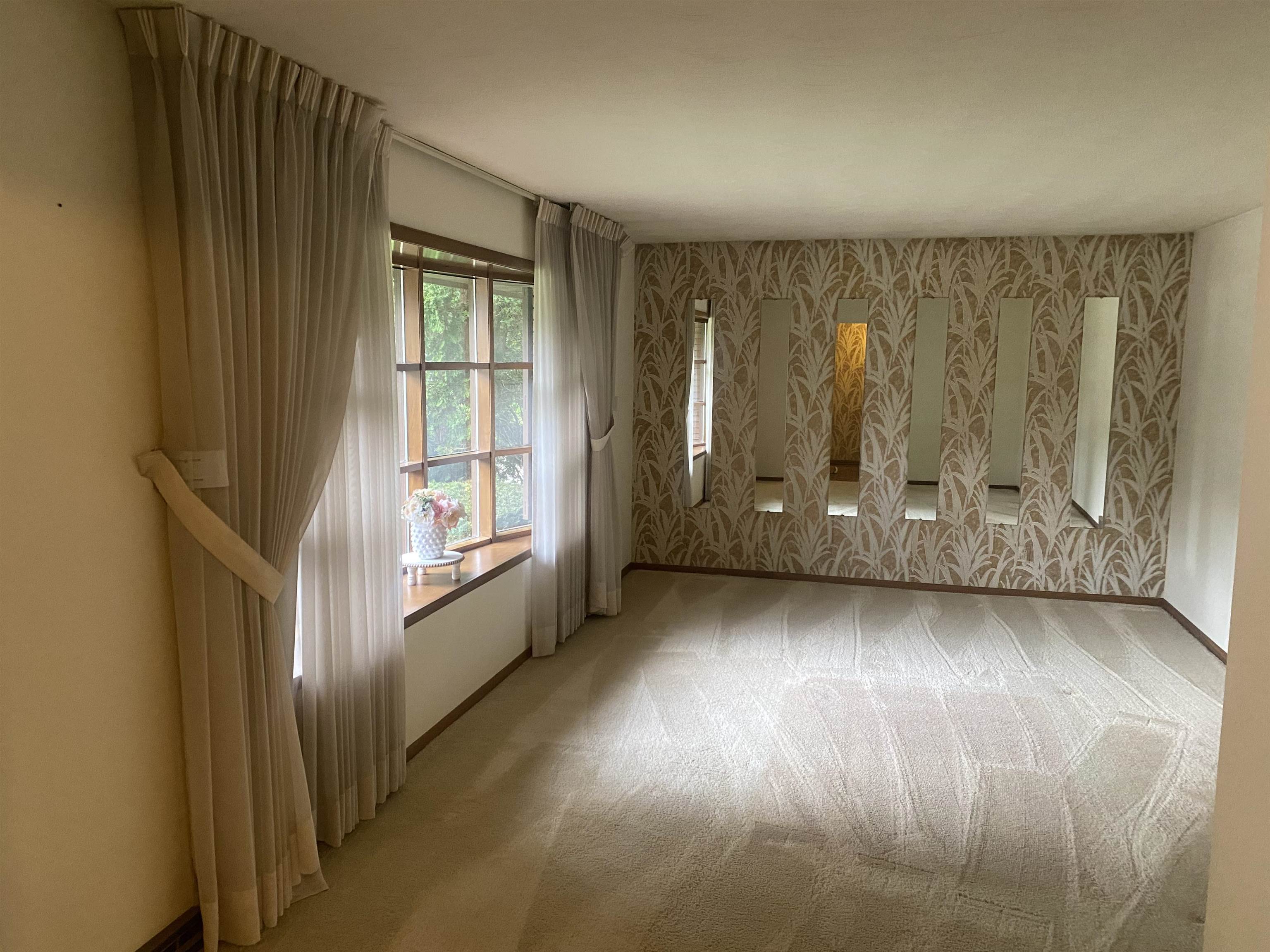 4006 Highcrest Road Rockford, IL 61107 - Photo 4 of 18 an empty room with wooden floor and windows