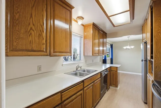 a kitchen with a sink and cabinets