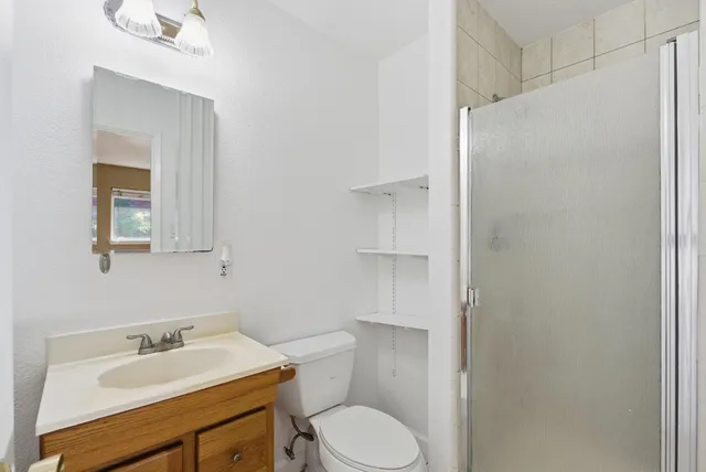 a bathroom with a sink toilet and vanity