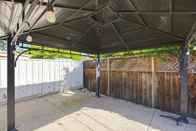 a front view of a house with a yard and a garage