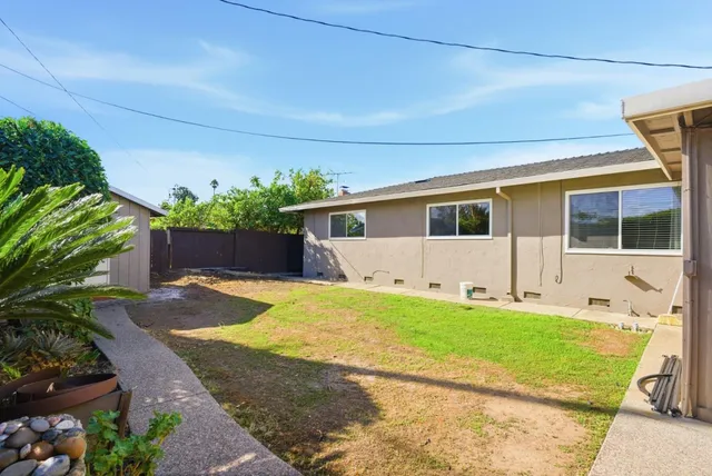 a patio with table and chairs