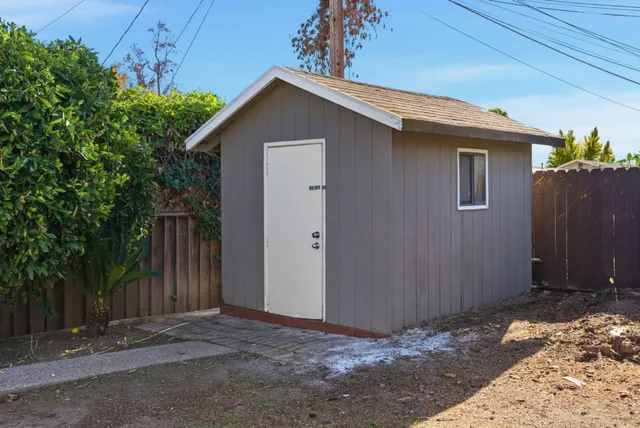 a view of a backyard of the house