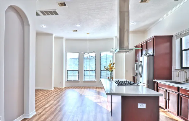 a view of a street with a cars parked in front of it