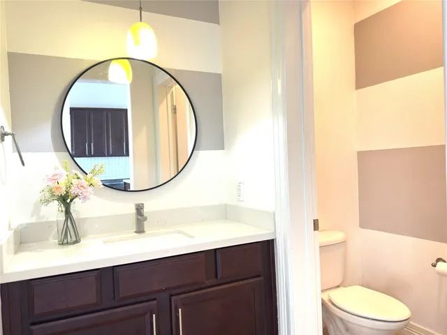 a kitchen with stainless steel appliances granite countertop a refrigerator and microwave