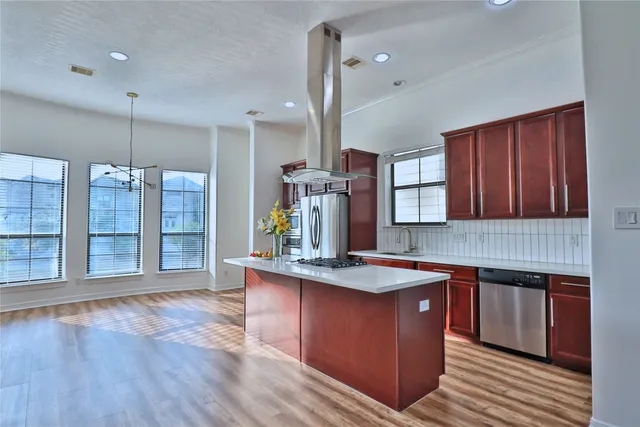 a front view of a residential apartment building with a yard