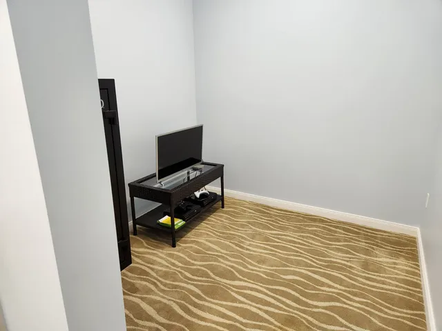 a view of workspace with wooden floor windows