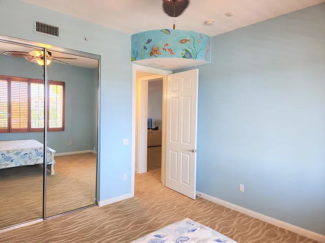a view of a room with wooden floor and window