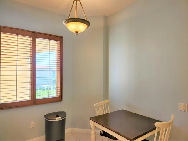 a room with a chair and a window