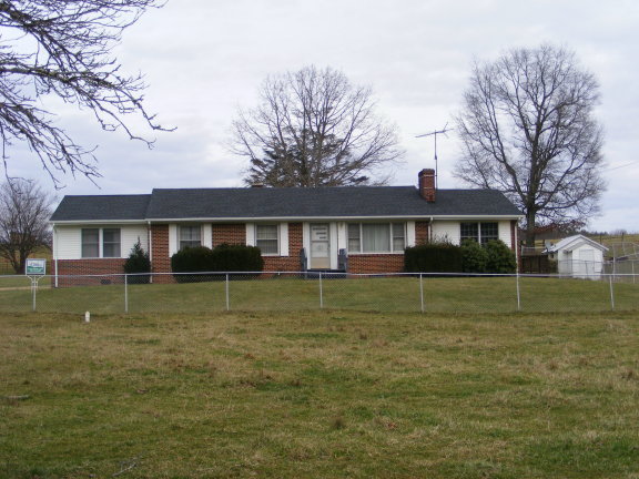 227 Remington Road Southeast Floyd, VA 24091 - Photo 3 of 11 a front view of a house with a yard