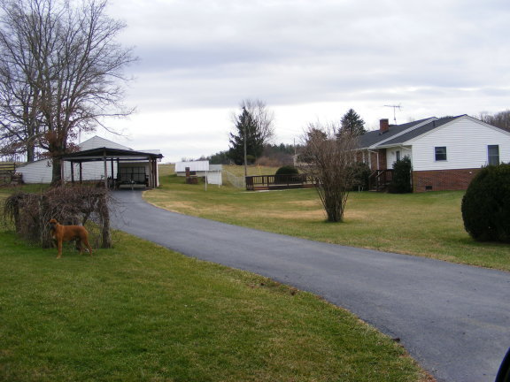 227 Remington Road Southeast Floyd, VA 24091 - Photo 4 of 11 a view of a house with a big yard and a large trees