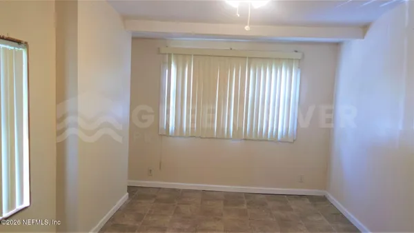 an empty room with windows