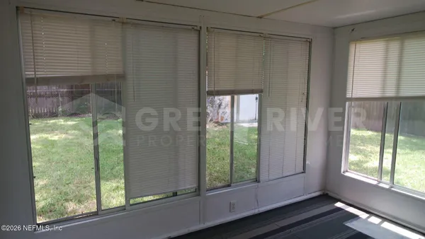 a view of a window in an empty room