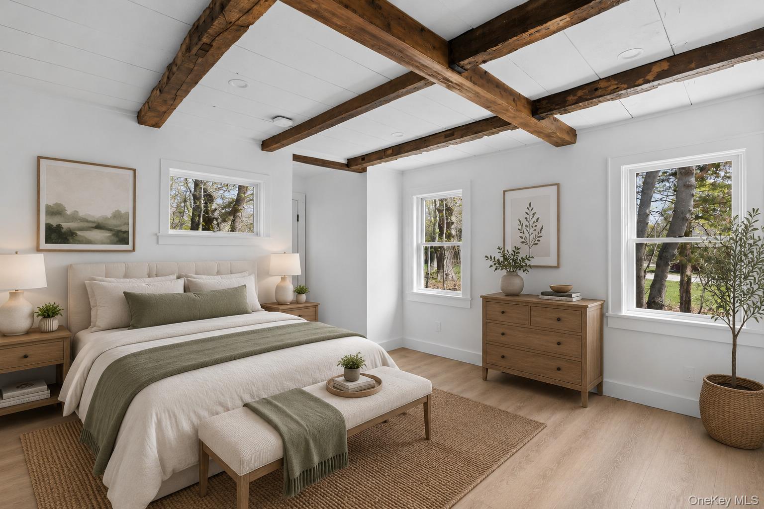 5075 Main Road Laurel, NY 11948 - Photo 7 of 22 a bedroom with a bed and wooden floor
