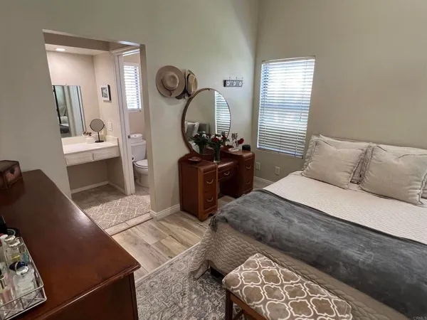 a bedroom with a bed and window
