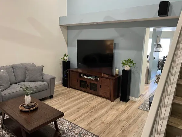 a living room with furniture and a rug