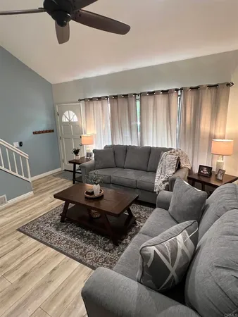 a living room with furniture and a flat screen tv