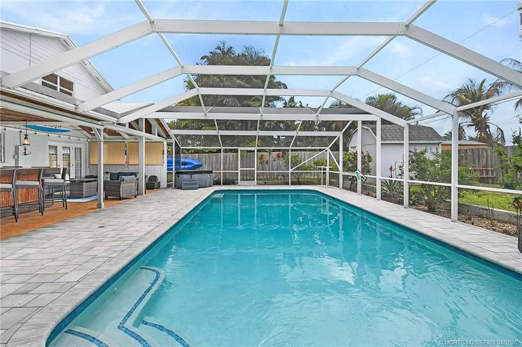 4729 Southeast Glen Ridge Trail Stuart, FL 34997 - Photo 22 of 81 a view of a backyard with a patio