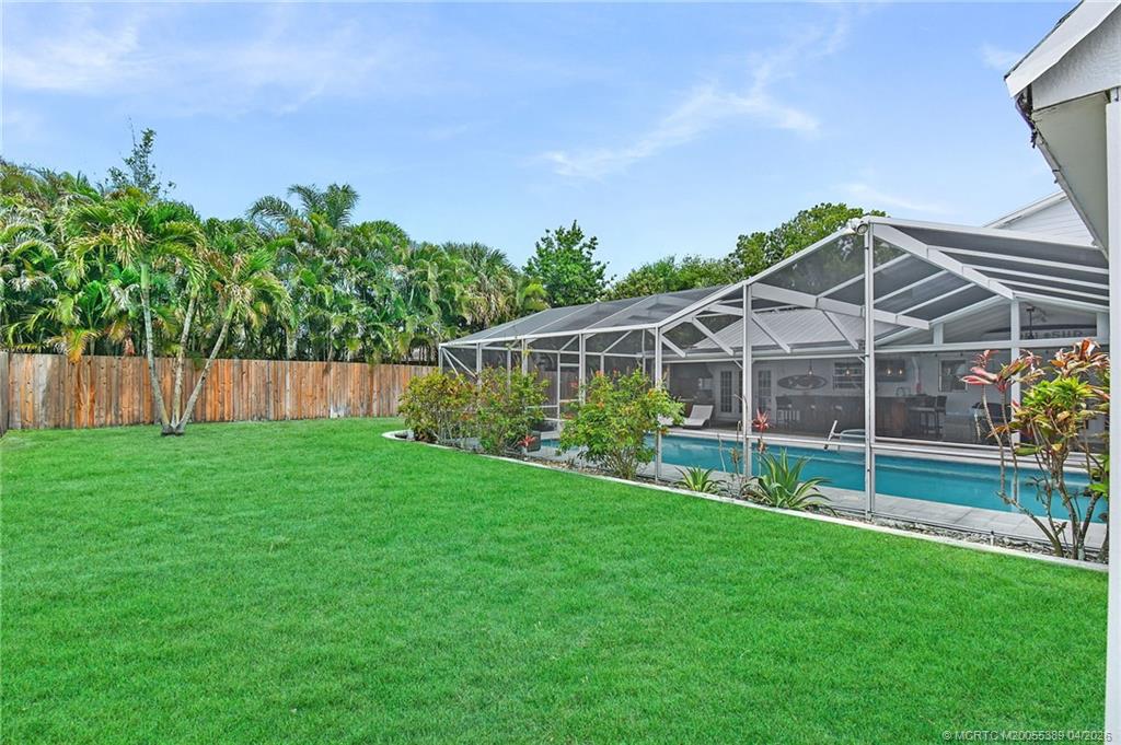4729 Southeast Glen Ridge Trail Stuart, FL 34997 - Photo 25 of 81 a view of a house with a yard