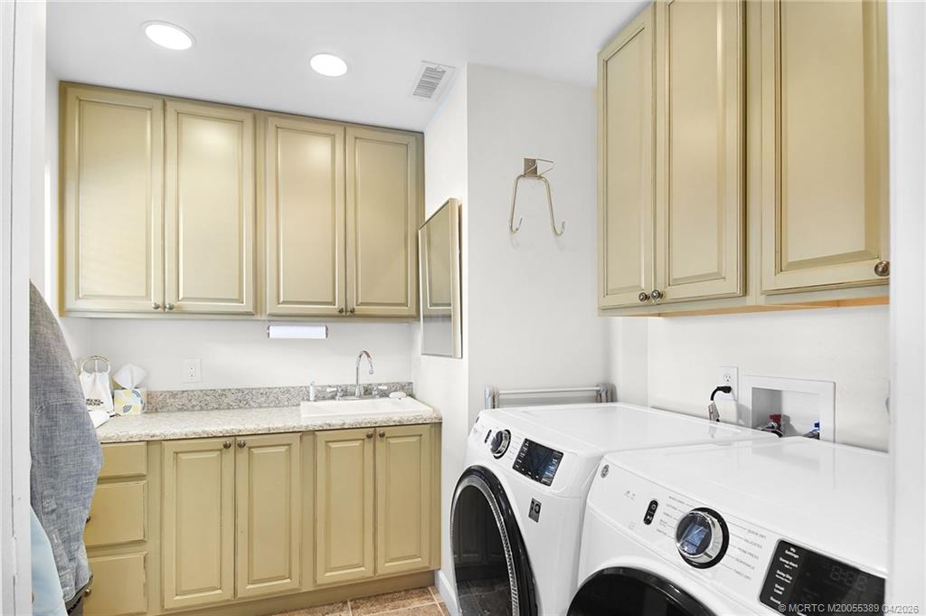 4729 Southeast Glen Ridge Trail Stuart, FL 34997 - Photo 47 of 81 a utility room with dryer and washer