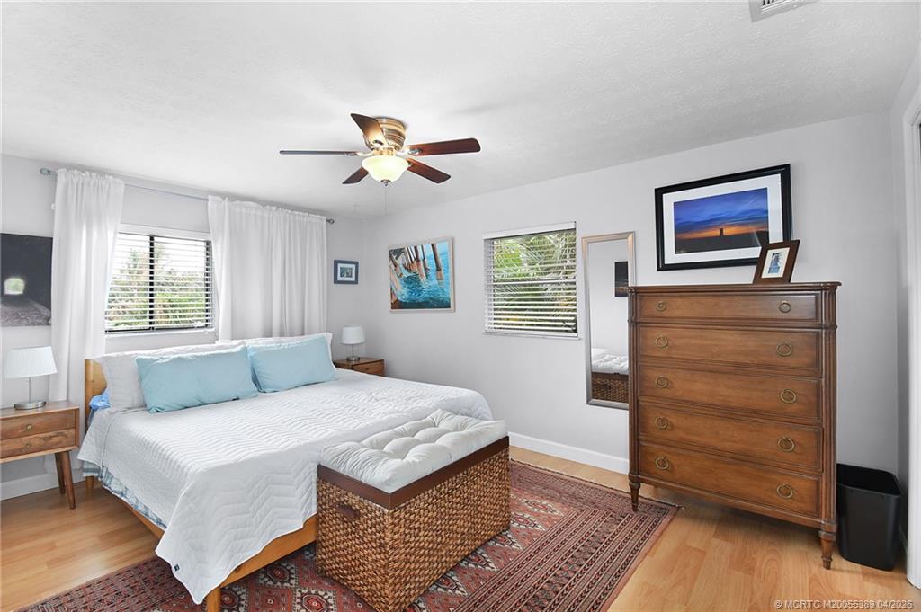 4729 Southeast Glen Ridge Trail Stuart, FL 34997 - Photo 51 of 81 a bedroom with a bed and a dresser