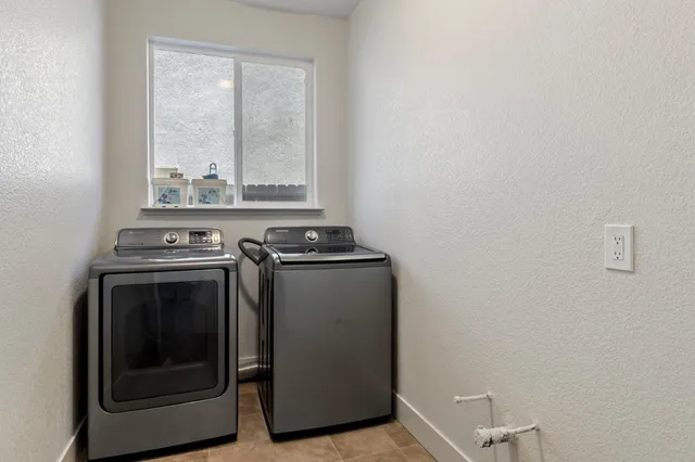 a view of a utility room with washer and dryer