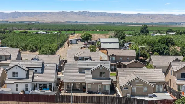 an aerial view of residential houses and outdoor space