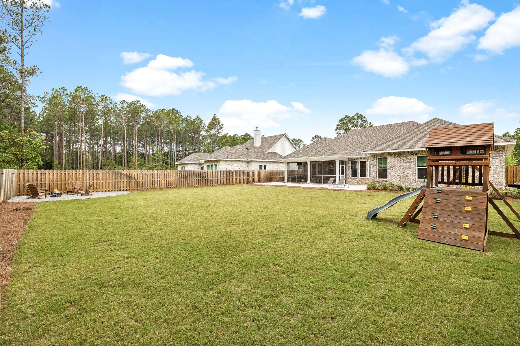 39 West Captain Fritz Way Freeport, FL 32439 - Photo 3 of 33 a view of a house with a backyard