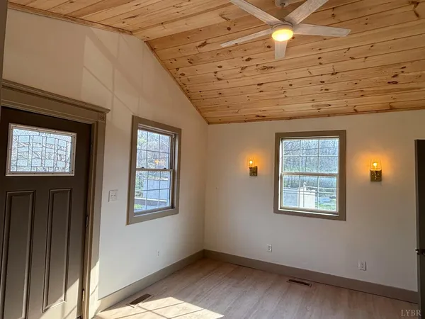 a view of an empty room with a window