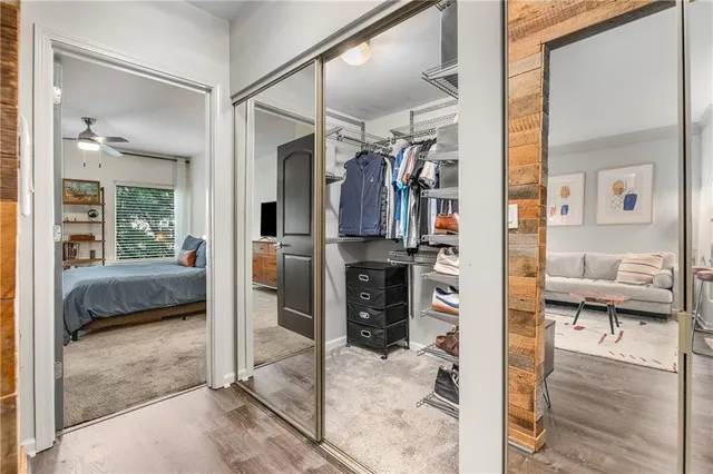 a living room with furniture and a glass door shower