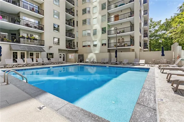 a view of pool with outdoor seating