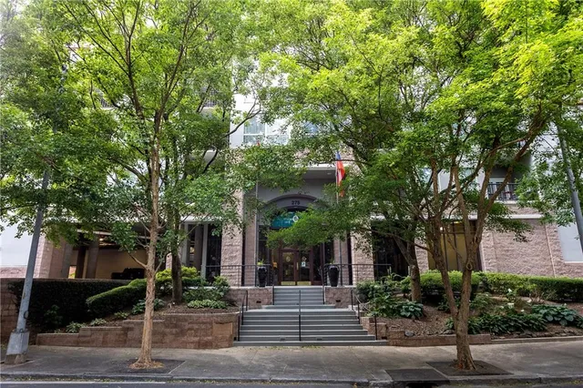 front view of a house with a tree