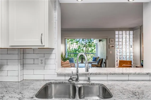 a kitchen with a sink and a window