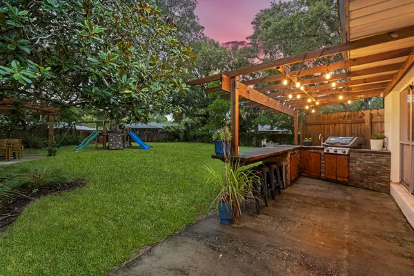 a view of a chairs and table in a yard