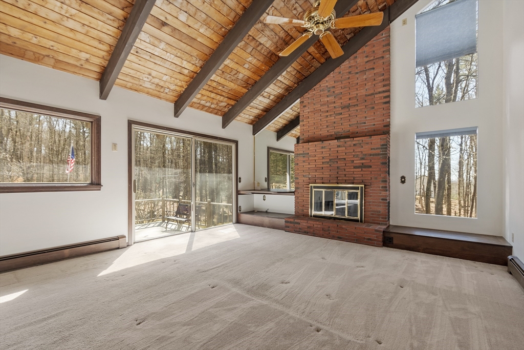 22 Briggs Road Petersham, MA 01366 - Photo 17 of 41 a view of an empty room with brick walls and a fireplace