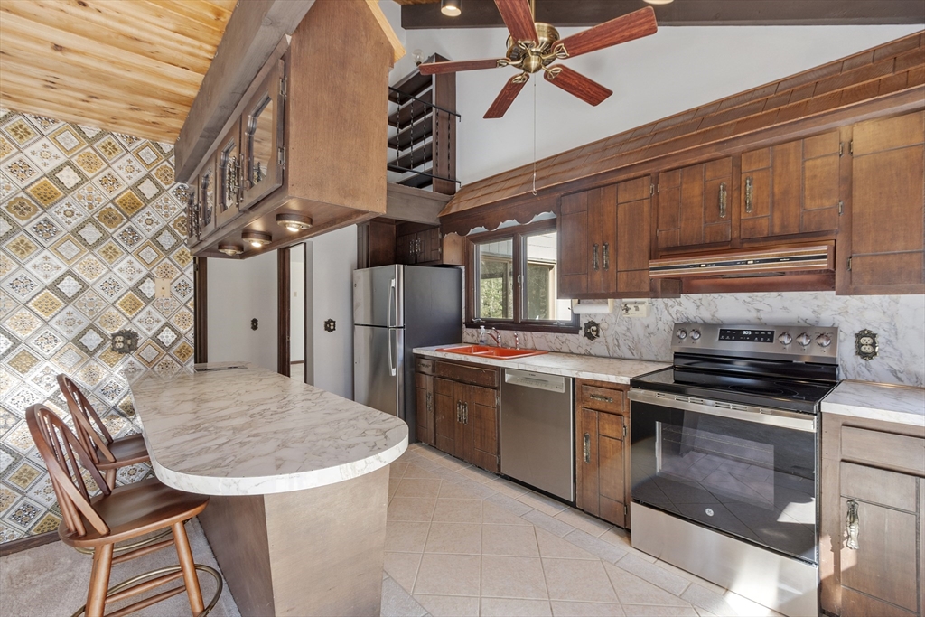 22 Briggs Road Petersham, MA 01366 - Photo 24 of 41 a kitchen with stainless steel appliances a stove a sink dishwasher and cabinets